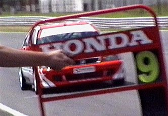 Bill sweeps by the pit wall